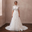 White lace wedding dress with high neck and full A-line tulle skirt, short lace sleeves