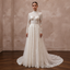 Ivory high-neck lace wedding dress with long sleeves and full tulle skirt, corset bodice