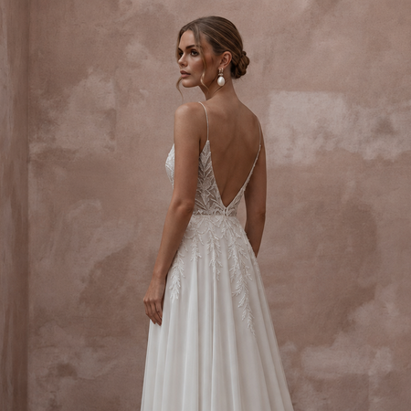 Beach Destination Bridal Gown with Spaghetti Straps and Flowing Skirt