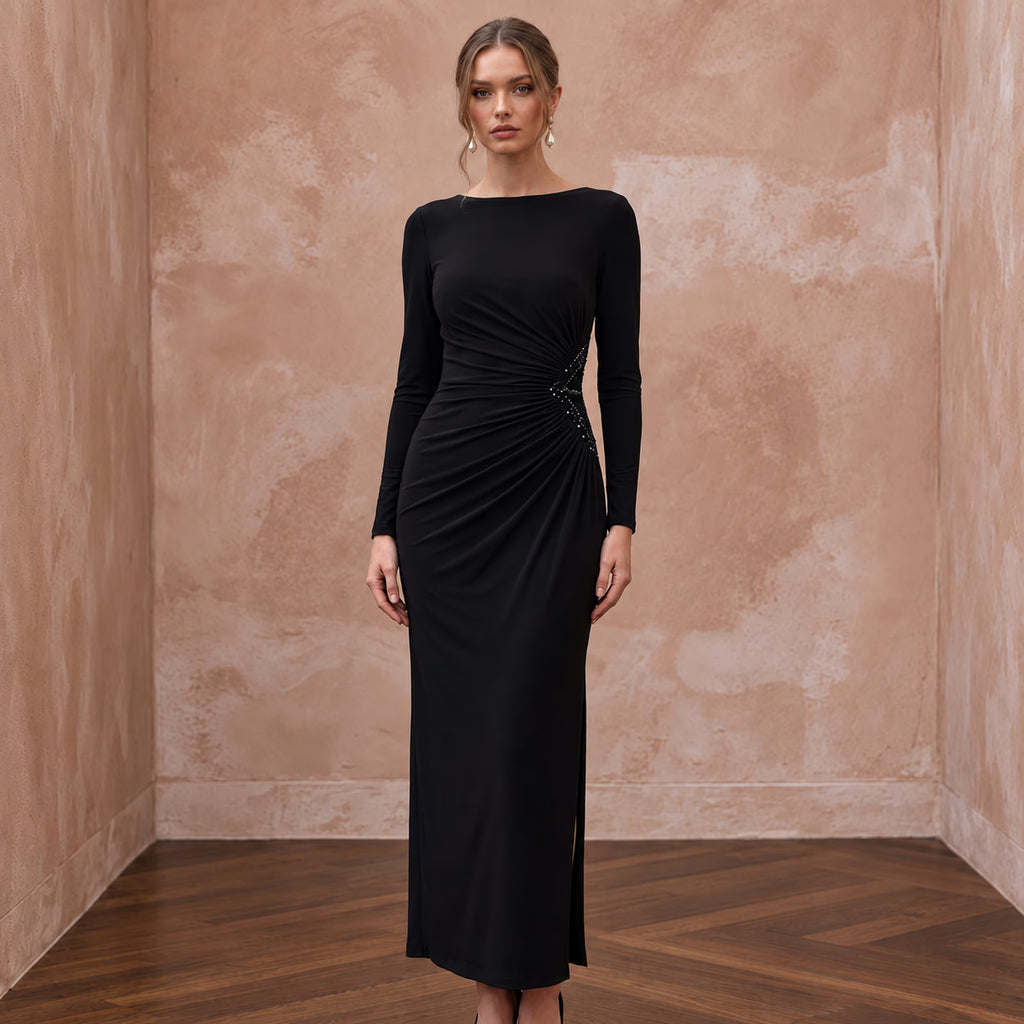 Black minimalist long sleeve ruched cocktail dress in stretch jersey, featuring elegant detailing and a side split.