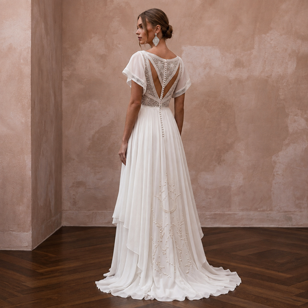 Ivory chiffon wedding dress with open back lace and flowing A-line skirt