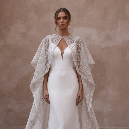 Cape Wedding Dresses with Dramatic Cathedral Trains