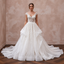 Elegant cathedral train organza wedding dress with floral embroidery and a fitted bodice, perfect for a formal ceremony.