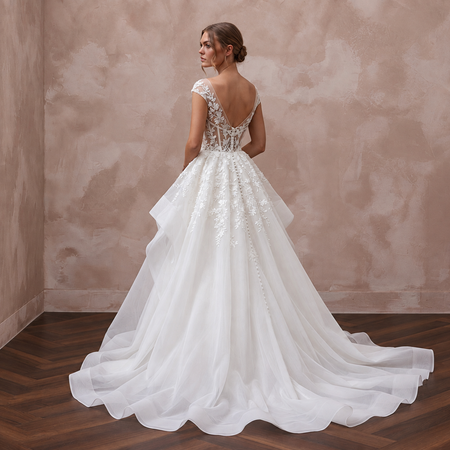 Elegant organza wedding dress with cathedral train, lace detailing, and a graceful back design for a formal ceremony.