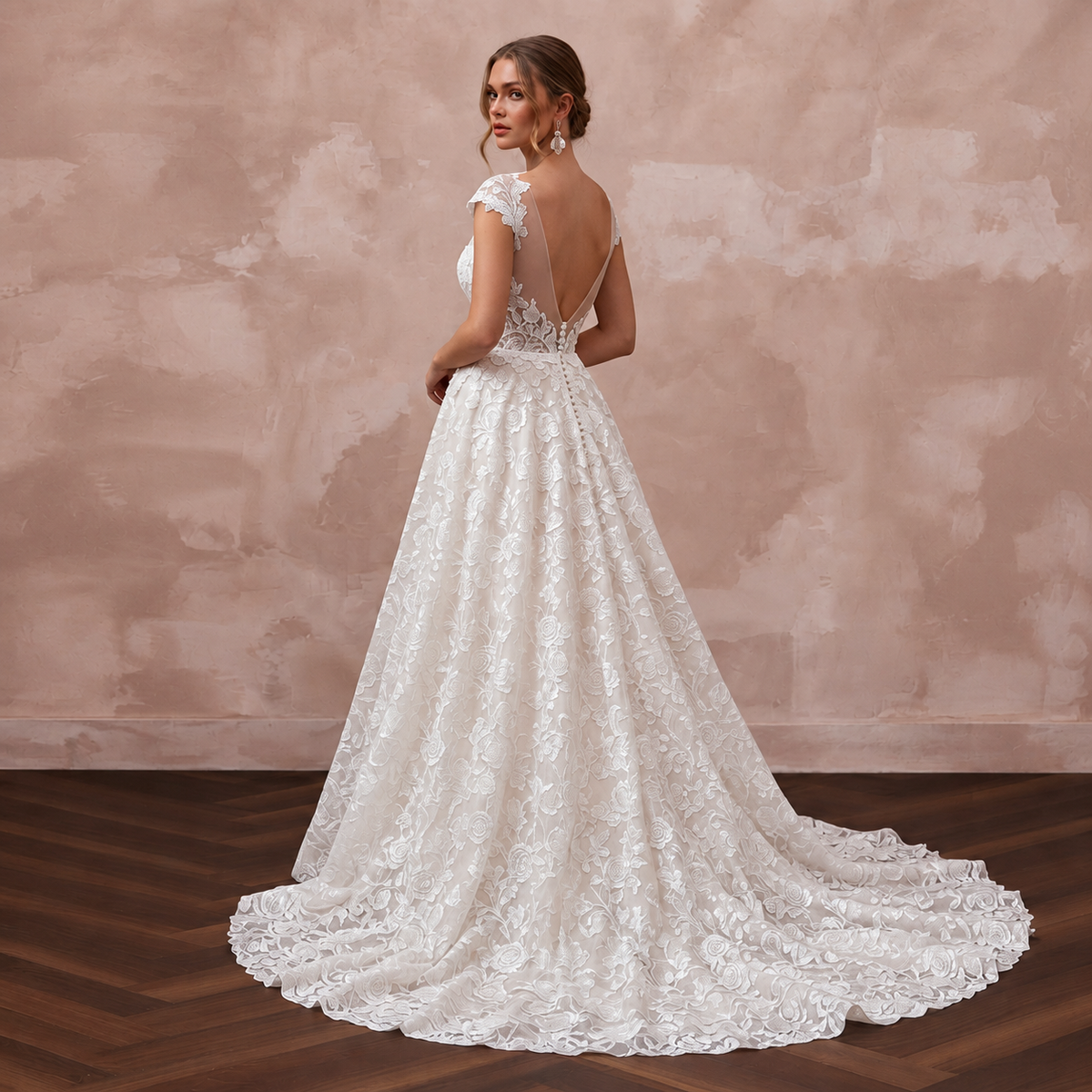 Elegant chapel train bridal dress with floral lace details, perfect for a romantic garden wedding.