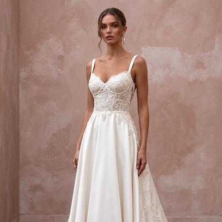 Elegant satin bridal dress featuring intricate beading, perfect for a vineyard wedding with a chapel train.
