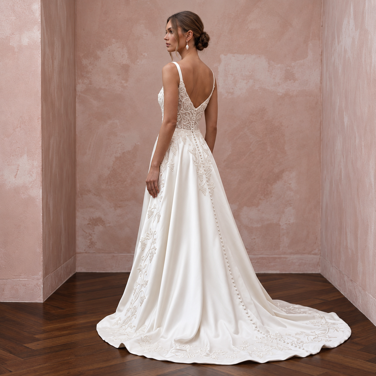 Elegant satin bridal dress with chapel train, featuring intricate embroidery, perfect for a vineyard wedding.