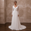 White chiffon A-line bridal dress with long lace sleeves and V-neck bodice
