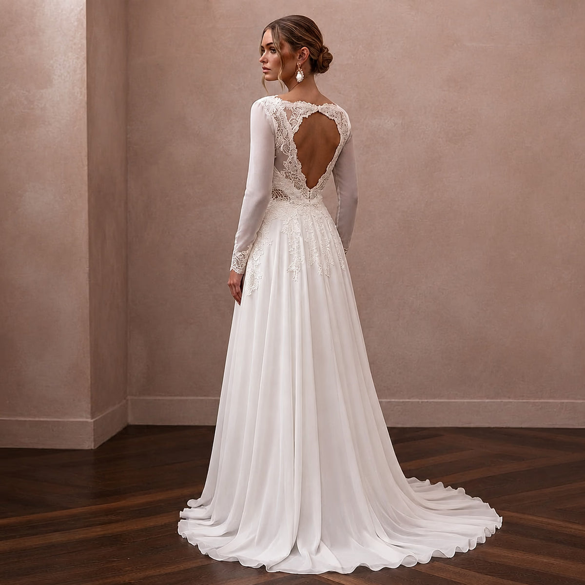 White chiffon A-line bridal dress with long sleeves and lace open back