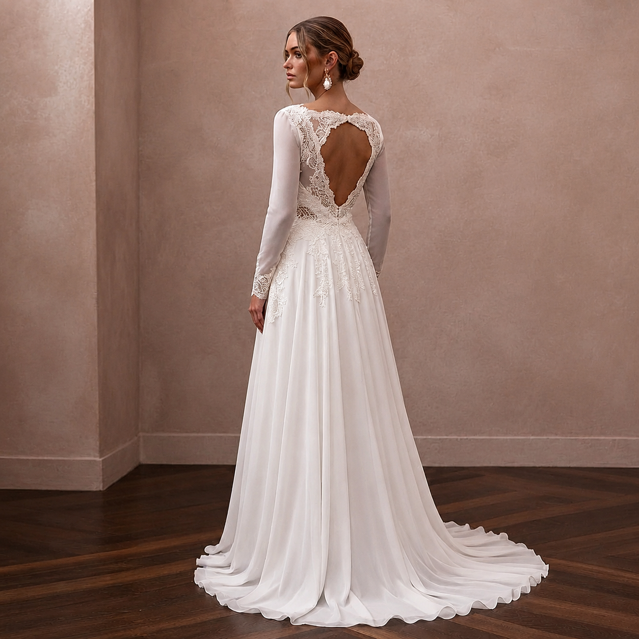 White chiffon A-line bridal dress with long sleeves and lace open back