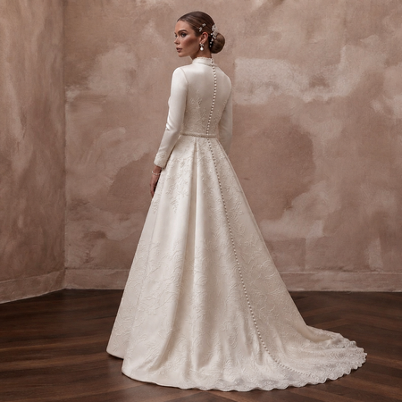 Ivory satin wedding dress back view with long sleeves, high neck, pearl-trim tie