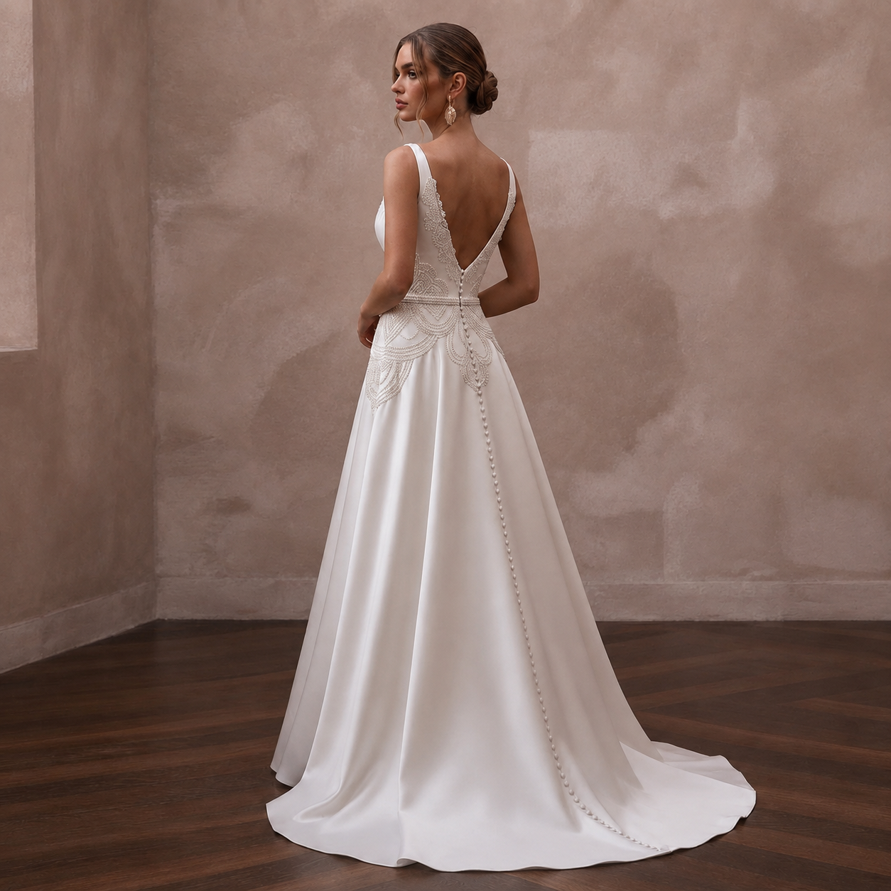 White satin A-line wedding dress with lace V-back and long draped back detail