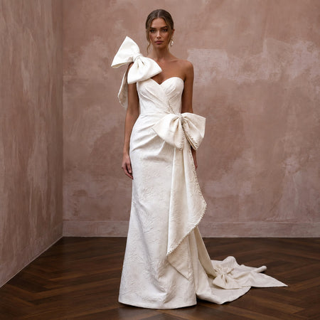 Contemporary Wedding Dresses with Oversized Bow Details - Apparel & Accessories > Clothing > Wedding & Bridal Party Dresses > Wedding Dresses - Mignonette Bridal