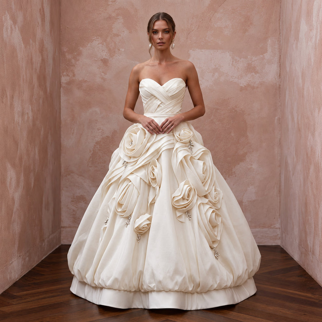 Cream satin face organza wedding gown with bubble skirt and rose details, featuring a strapless design.