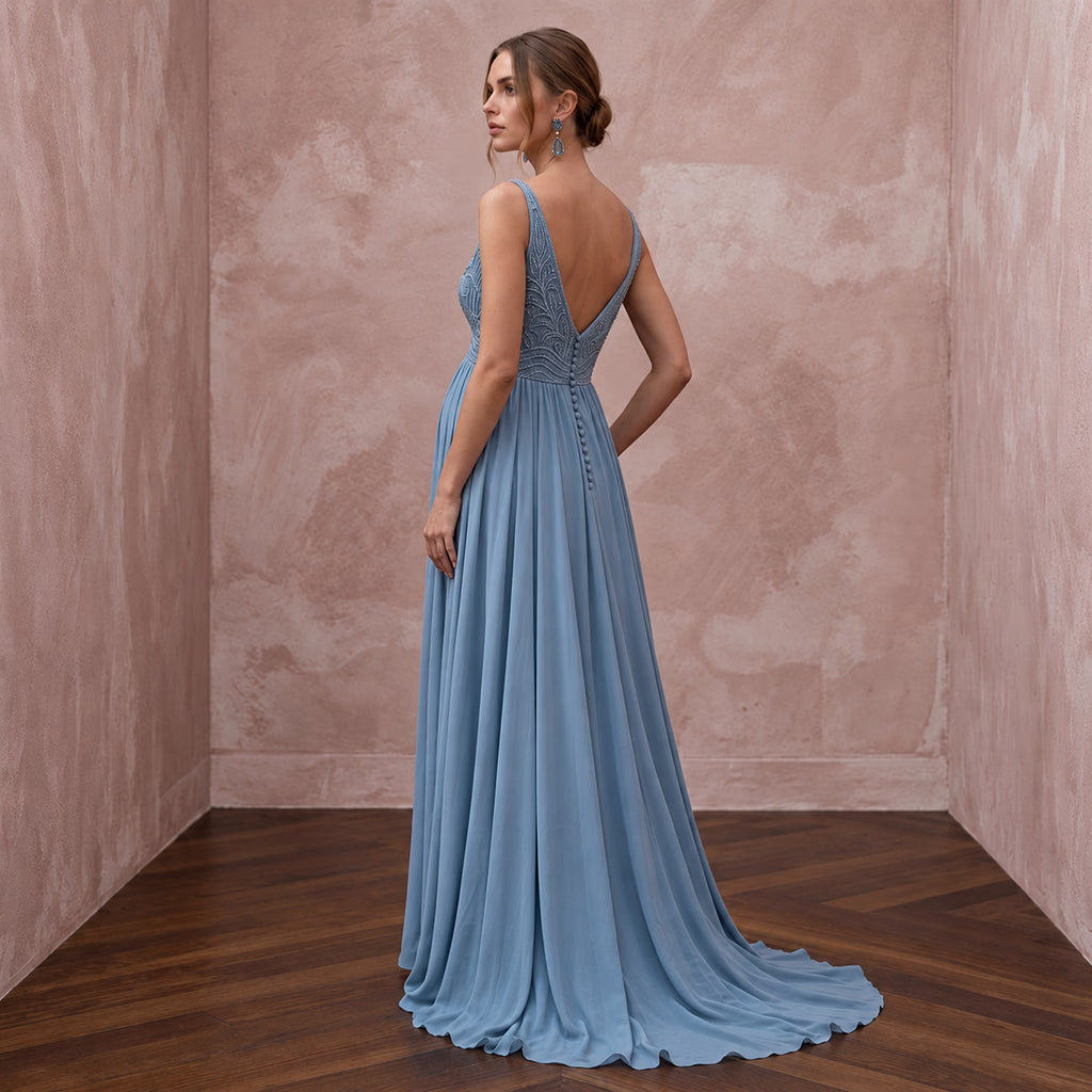 Dusty blue flowing georgette empire waist maternity formal dress, featuring elegant detailing and back buttons.