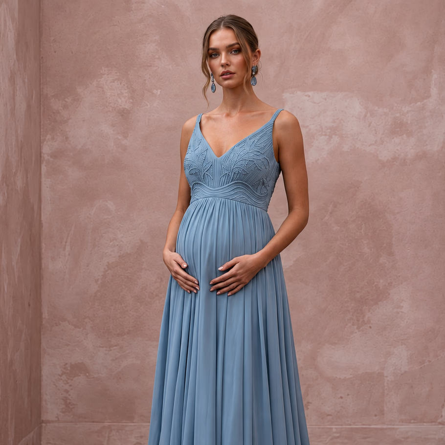 Dusty blue flowing georgette empire waist maternity formal dress, featuring elegant detailing and a flattering silhouette.