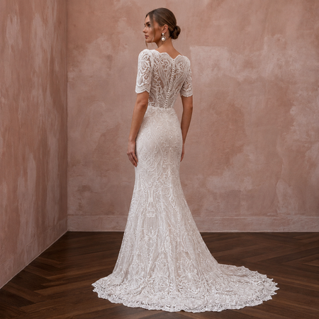 White lace back wedding dress with short sleeves and fitted mermaid silhouette