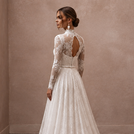 White lace wedding dress with long sleeves, open back lace panels, and lace buttons
