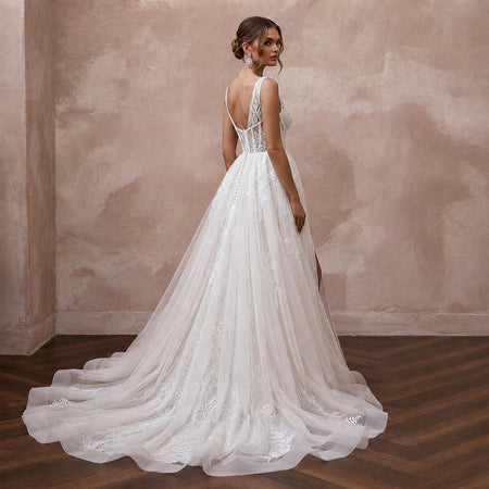 Elegant Lace Wedding Gown with Detachable Train for a Beach Wedding