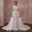 White lace wedding gown with long sleeves and full embroidered skirt, detachable train