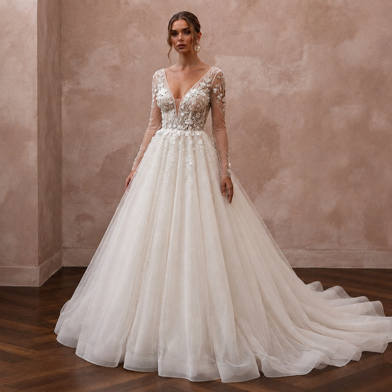 Ivory tulle ball gown wedding dress with lace bodice, deep V-neck and long sleeves