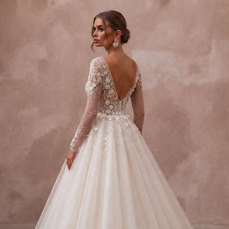 Ivory tulle ball gown wedding dress with long lace sleeves and V-neck back