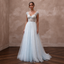 Ethereal Blue-Tinged White Tulle Gown for Ice Hotel Reception