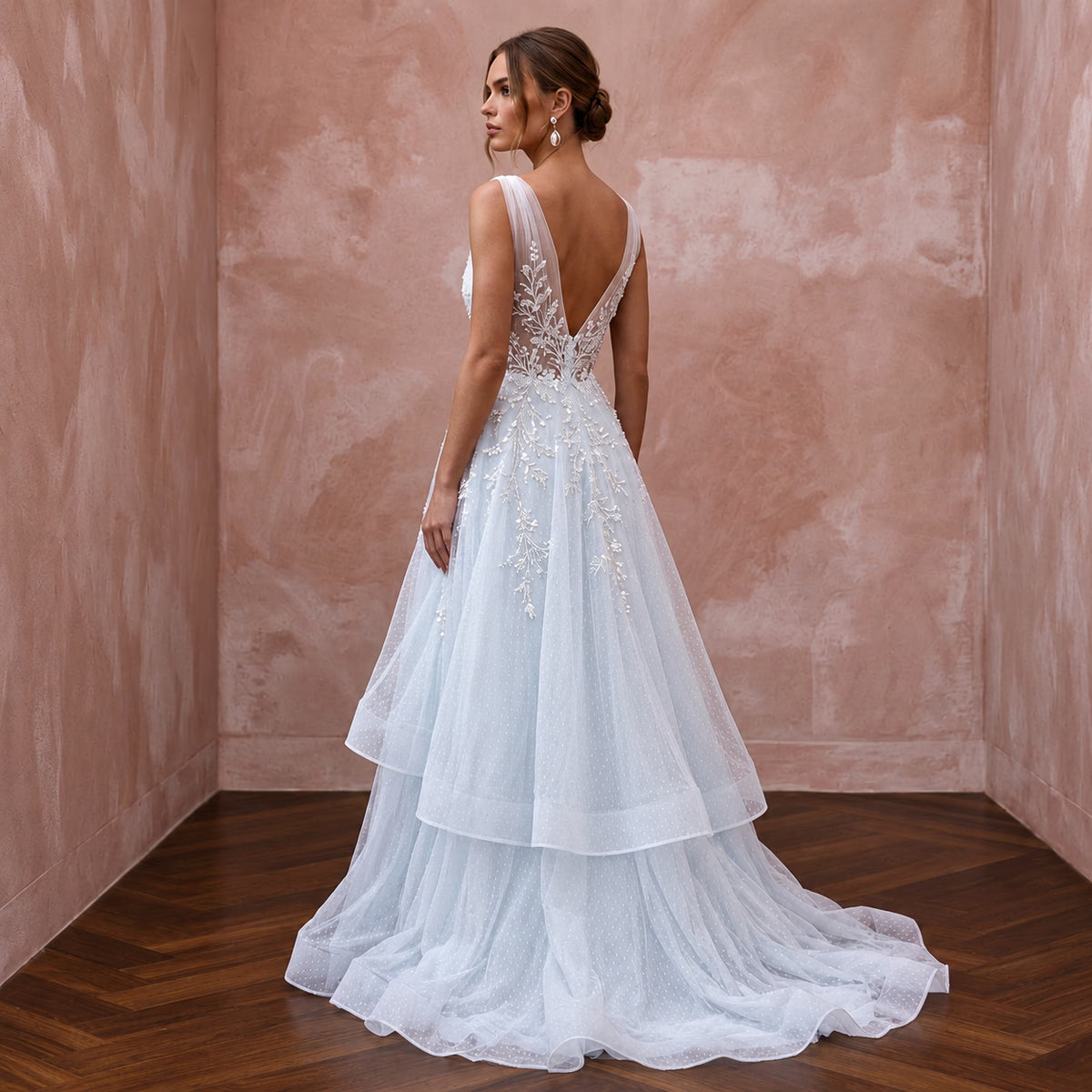 Ethereal Blue-Tinged White Tulle Wedding Gown for Ice Hotel Reception
