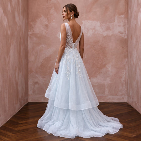 Ethereal Blue-Tinged White Tulle Wedding Gown for Ice Hotel Reception