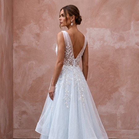 Ethereal Blue-Tinged White Tulle Wedding Gown for Ice Hotel Reception