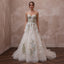 Garden-Inspired Wedding Gown with Embroidered Bodice and Flowing Skirt