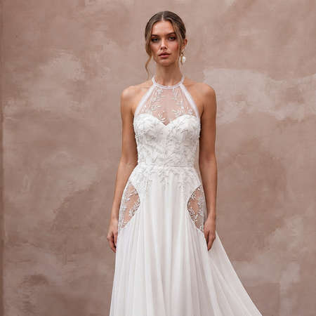 Elegant halter neck chiffon bridal gown with intricate embroidery, ideal for a beach wedding. Lightweight and airy design.