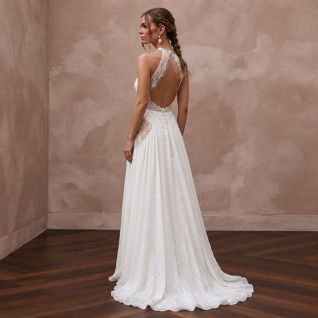 Halter neck chiffon bridal gown with lace detailing, perfect for a beach wedding, featuring a flowing silhouette.