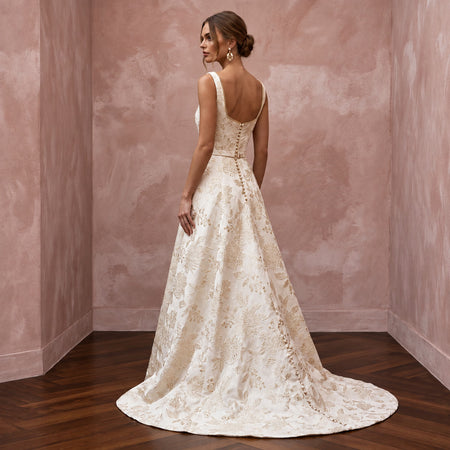 Ivory floral brocade square neck A-line dress with a flowing train, perfect for autumn weddings.