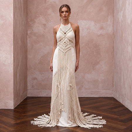Minimalist cream cotton macrame fringe halter dress, perfect for a desert bridal look. Elegant and unique design.