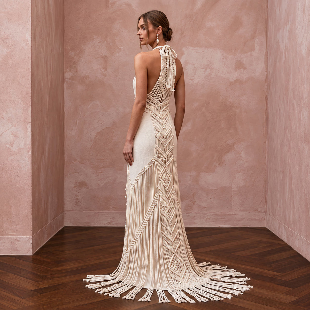 Elegant cream cotton macrame fringe halter dress, featuring intricate patterns and a flowing silhouette. Perfect for desert weddings.