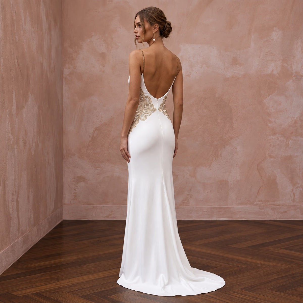 Minimalist ivory matte jersey cowl back sheath dress with elegant gold floral detail. Perfect for special occasions.