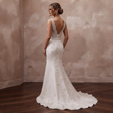 Sheath wedding dress with V-back, lace straps, and long train
