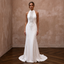 White high-neck wedding sheath dress with geometric lace embroidery and sleeveless cut