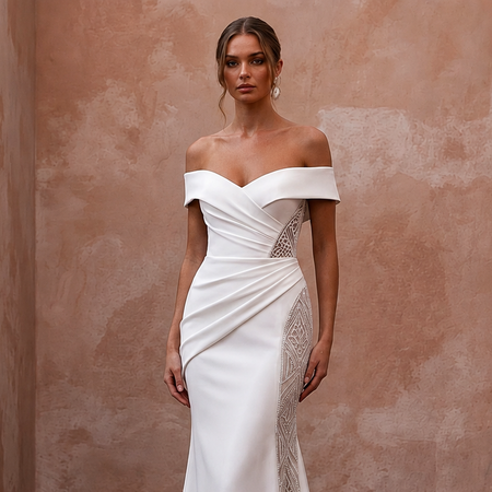 White off-the-shoulder wedding dress with draped bodice and lace side insert