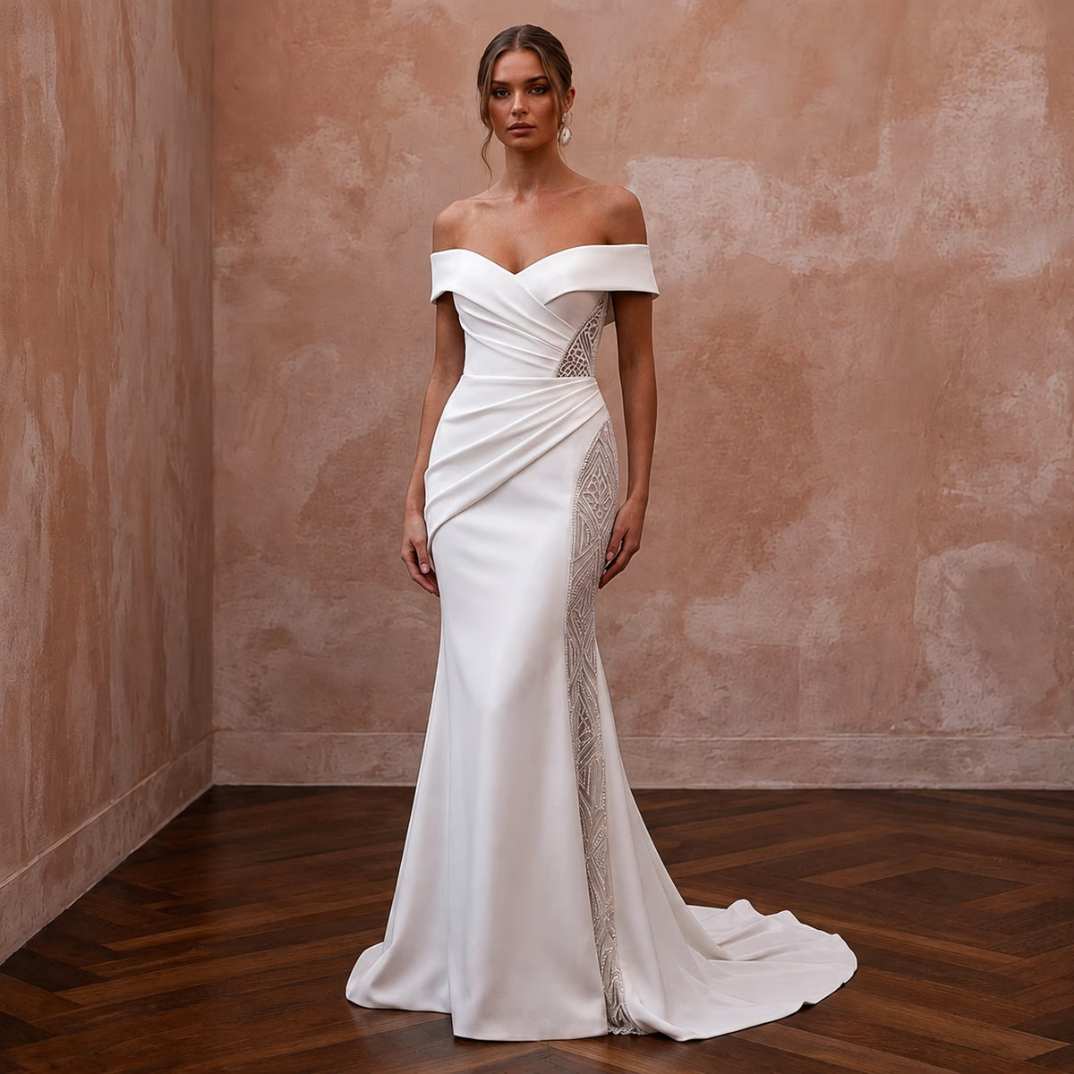 White off-the-shoulder mermaid gown with draped neckline and lace panel