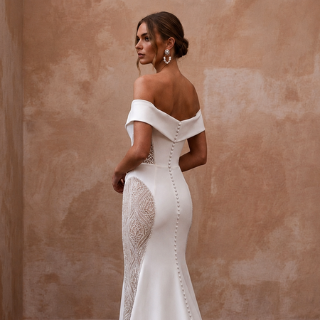 White off-the-shoulder mermaid wedding dress with embroidered lace side insert