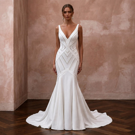 White V-neck mermaid wedding dress with geometric seaming and sleeveless bodice