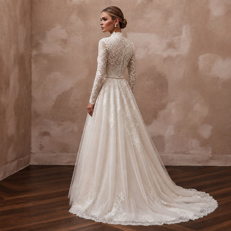 Ivory A-line wedding dress with high lace collar, long sleeves, embroidered tulle skirt and lace hem