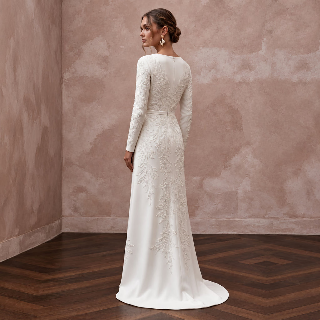 Long sleeve Alabaster Crepe maxi dress with wrap front and intricate embroidery, perfect for elegant occasions.
