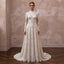 Lace bridal gown with long sleeves and high neckline, fitted bodice and A-line skirt