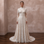 Lace bridal gown with long sleeves and high neckline, fitted bodice and A-line skirt