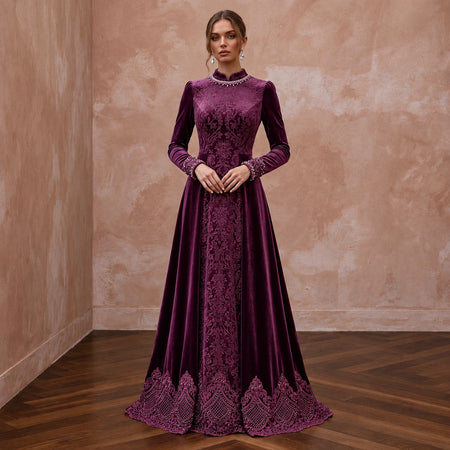 Modest plum purple velvet long sleeve A-line evening gown with intricate lace detailing at hem and cuffs.