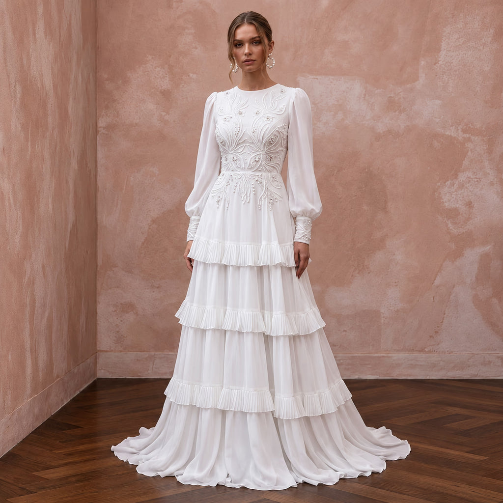 Elegant pure white chiffon gown featuring a tiered skirt and long sleeves, perfect for modest formal occasions.