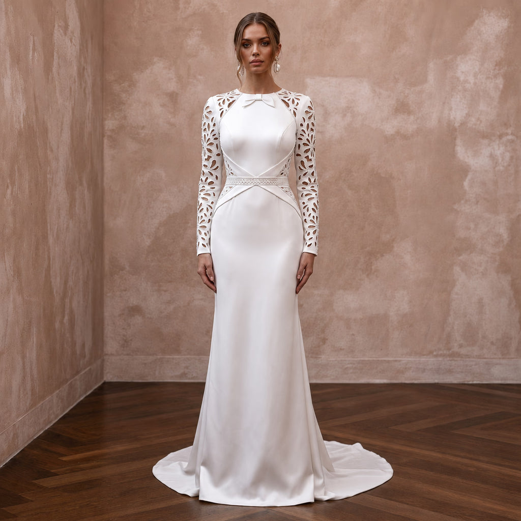 White satin sheath wedding dress with long sleeves and lace cutout bodice